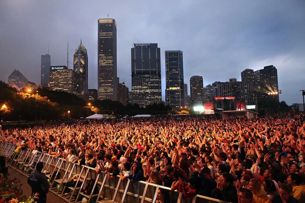 Lollapalooza Chicago Shows Skrillex Appreciation by Renaming "Perry's" Stage Lollapalooze Crowd with the Chicago Skyline in the background