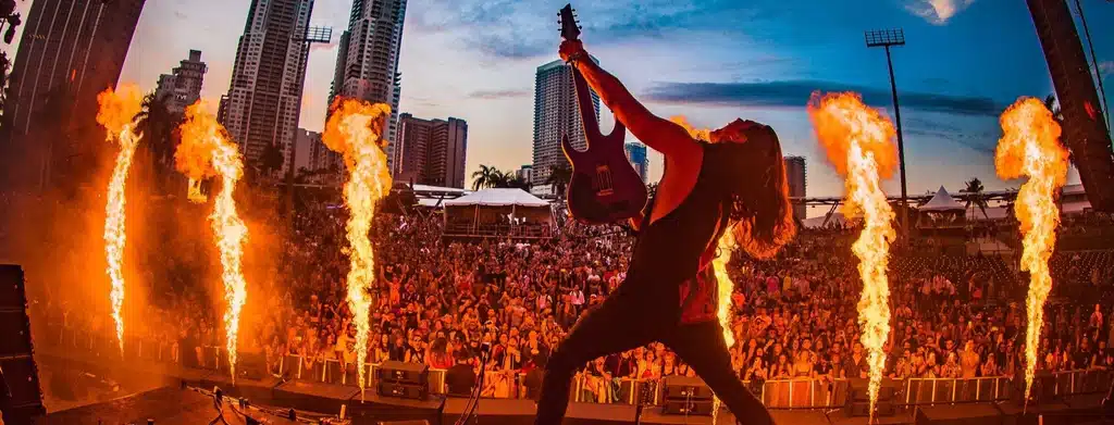 What is Dubstep? Sullivan King playing the guitar at a edm music festival