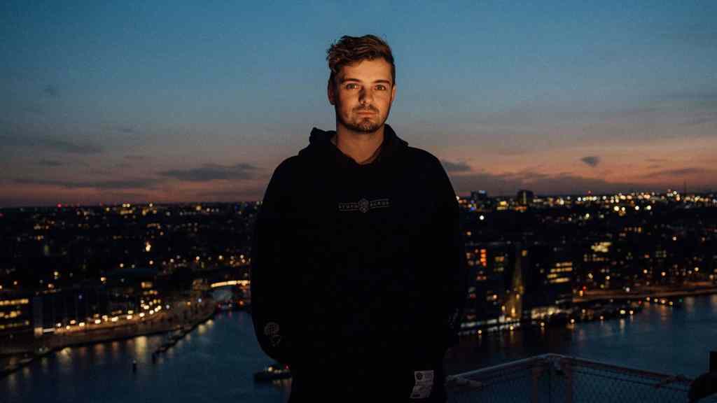 Martin Garrix Releases "Smile" with Carolina Liar Martin Garrix with Netherlands Skyline in the background