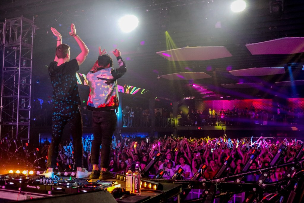 Loud Luxury hyping up the crowd on stage