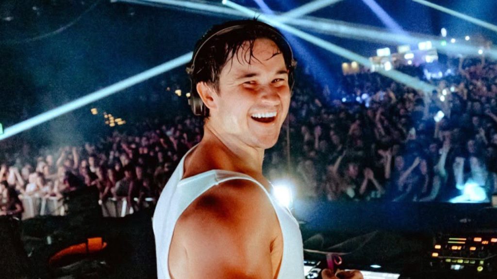 John Summit's 'Experts Only' to Debut NYC Music Festival Festival in September 2025 John Summit smiling while performing on stage in New York City