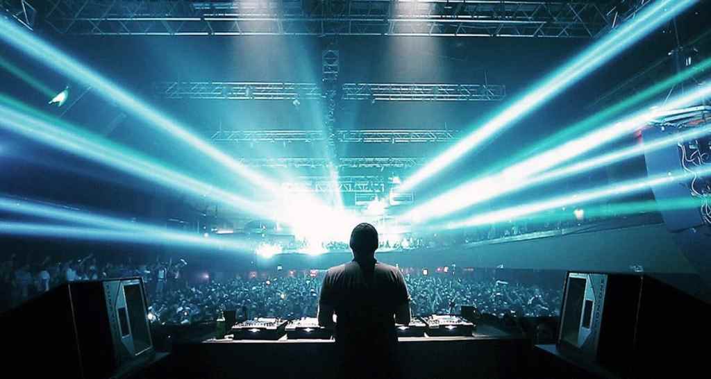 EDM Artist Performing EDM Rave artist performing on stage with bright lights